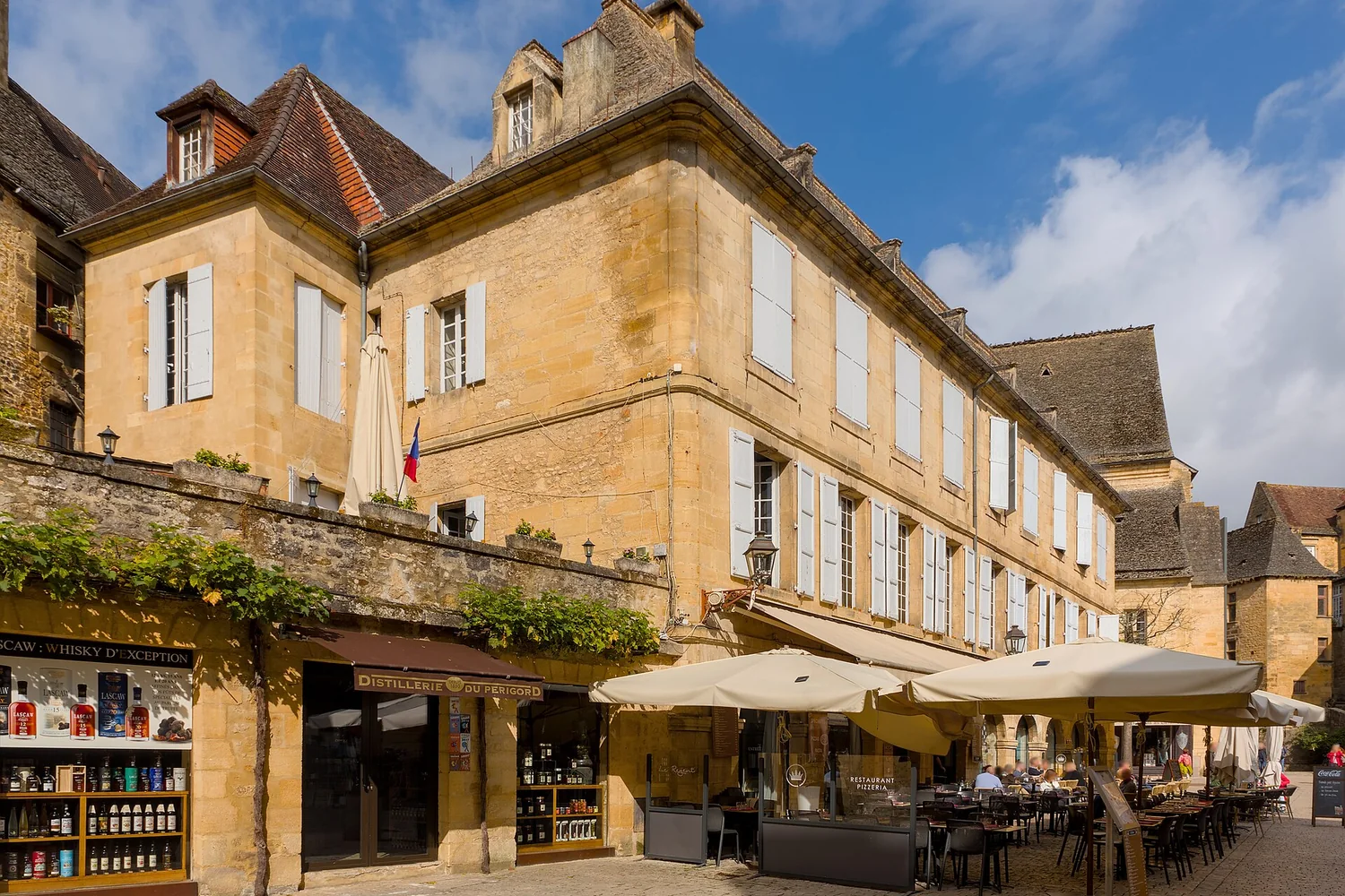Historic buildings and cafés on Place de la Liberté